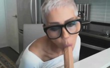 Short haired mature woman fucks her dildo