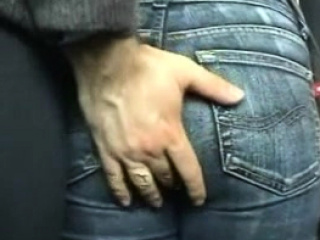 Fingering her ass in public