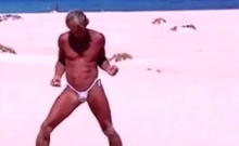 Tanned guy on beach in tiny string thong (temporarily!)