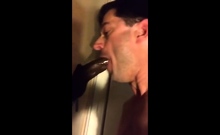 Amateur sucks big black cock at glory hole